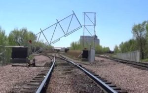 cantilever tilt gates for railroad track junctions